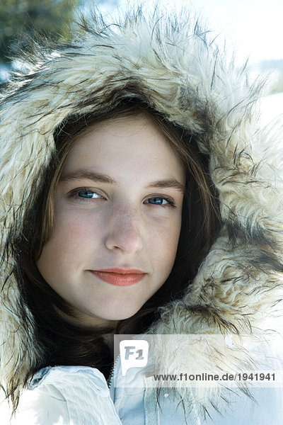 Teenage girl wearing parka  close-up portrait