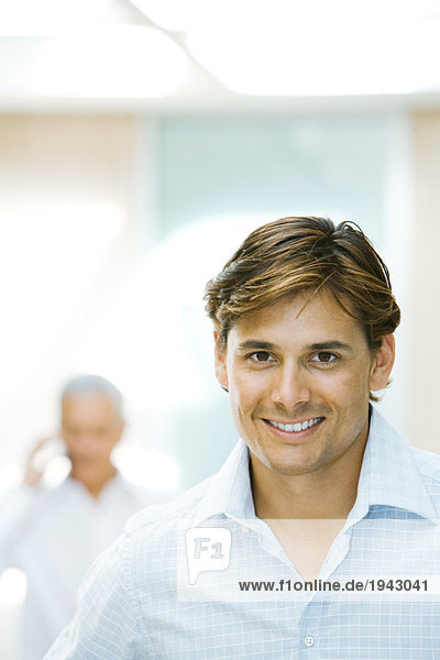 Businessman  smiling at camera  portrait