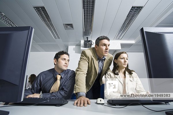 Group of people using computer