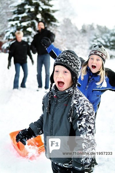 Family having fun in the slope