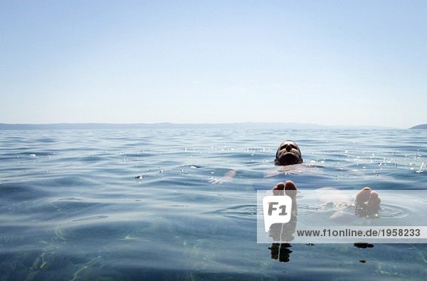 Guy floating in the water