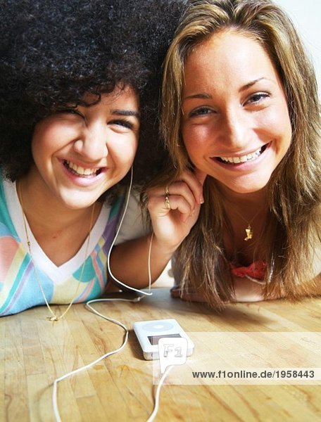 Girls listening to a mp3 player