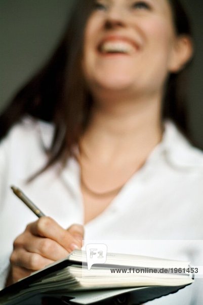 Woman taking notes