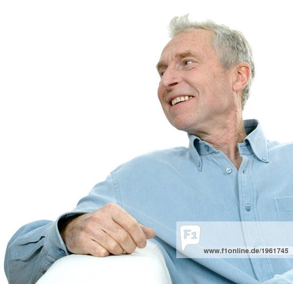 Man sitting with arm on armrest