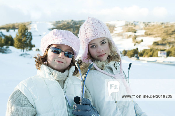 Two young skiers smiling at camera  portrait