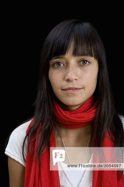 Portrait of a young woman wearing a scarf
