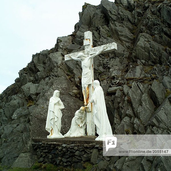 Stone crucifix and statues
