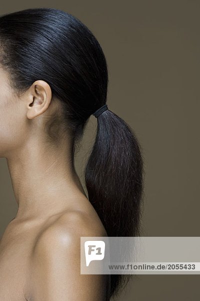 Side view of a woman with long black hair