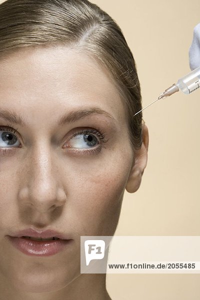 A woman having a botox injection