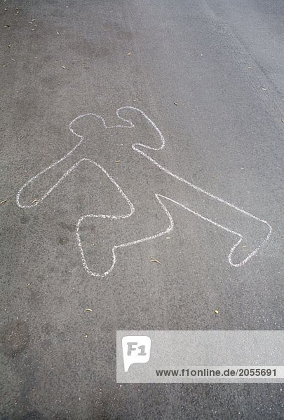 Eine Kreidekontur eines Körpers auf der Straße