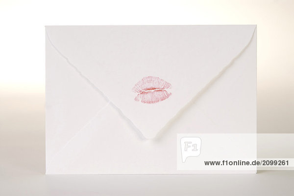 Envelope with lipstick kiss  close-up