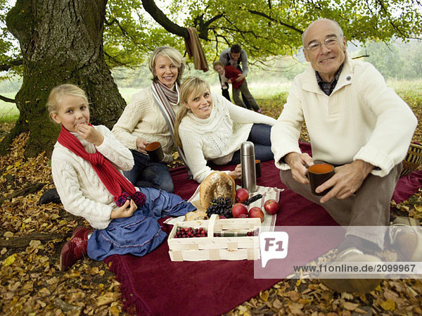 Germany  Baden-Württemberg  Swabian mountains  Three generation family having picnic in forest