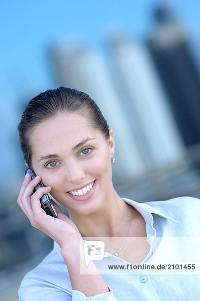 Businesswoman using mobile phone  portrait