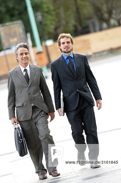 Businessmen walking on street