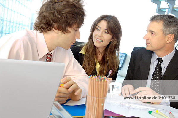 Business people discussing in office  smiling