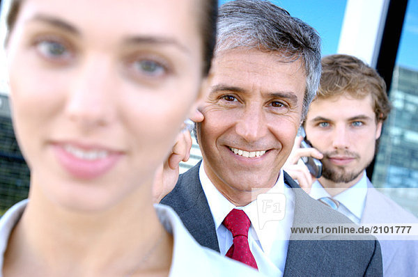 Business people in row  smiling  portrait