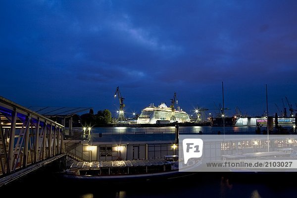 Cruise ship at harbor at night  Hamburg Harbor  Hamburg  Germany