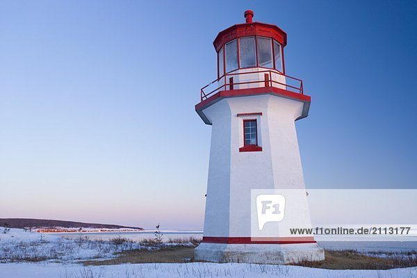 View of Cap Blanc lighthouse and Œle Bonaventure at sunset  Quebec