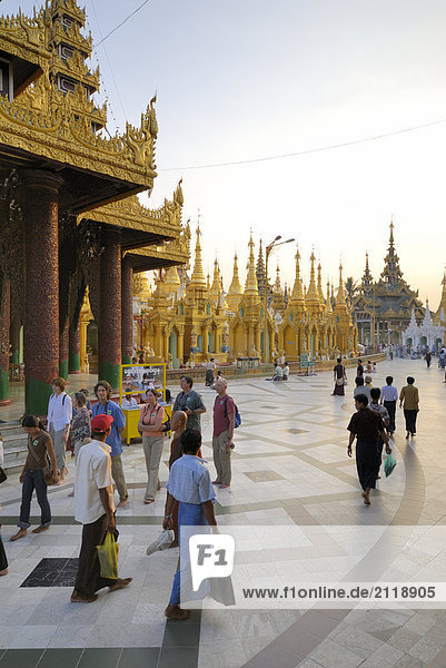 Group of people in Buddhist temple  Shwedagon Pagoda  Yangon  Myanmar