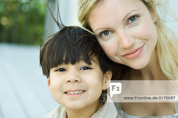 Mother and son smiling at camera  portrait