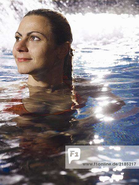 Woman swimming in pool  smiling  close-up