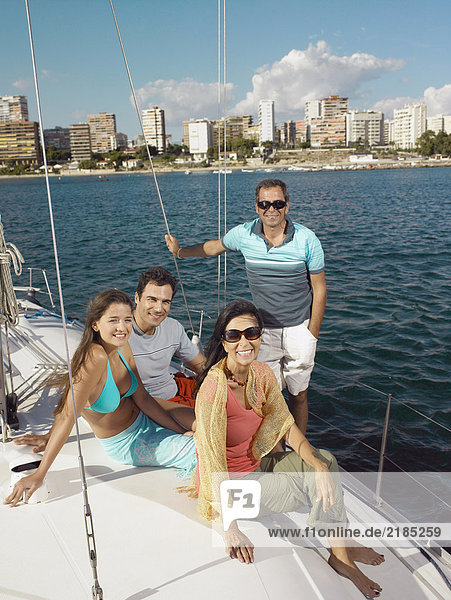 Mature parents and young couple relaxing on yacht  portrait
