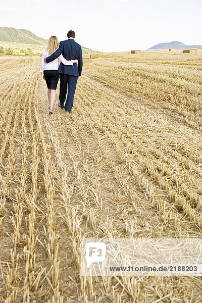 Couple in a wheat field.