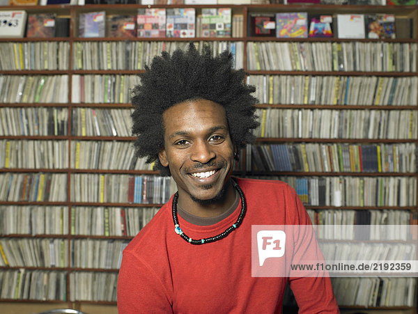 Man in music shop  smiling  portrait