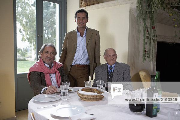 Three generation family at table  portrait