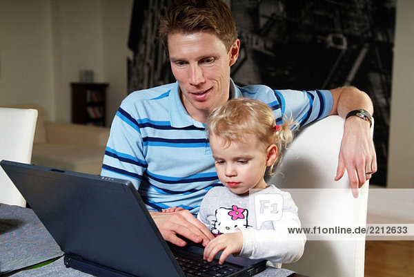 Man and child at the computer