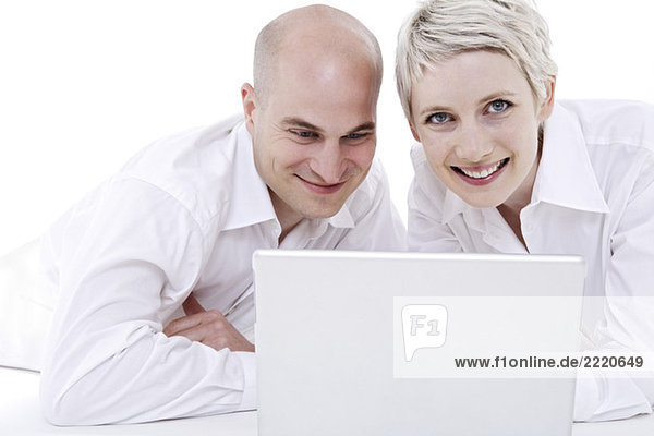 Young couple using laptop  portrait