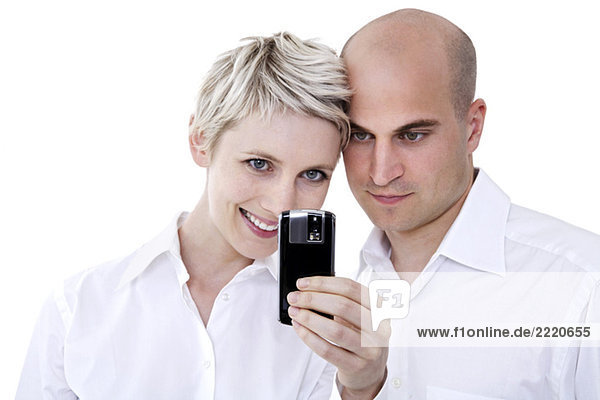 Young couple with mobile phone  portrait