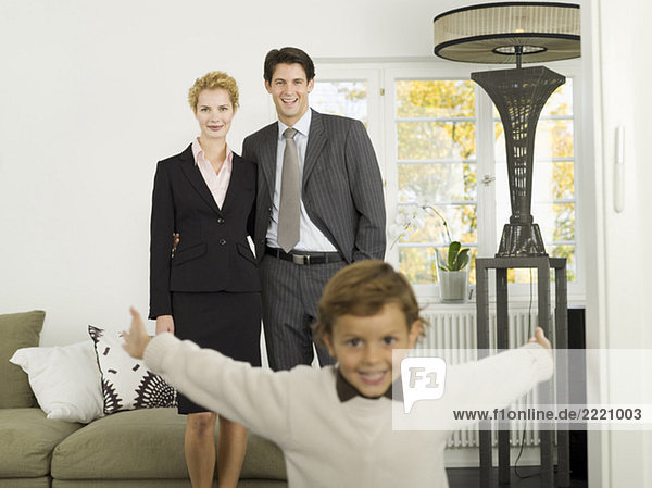 Family standing in livingroom  portrait