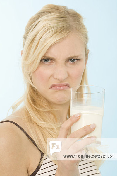 Woman drinking glass of milk  portrait