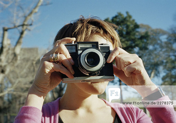 A woman taking a photograph