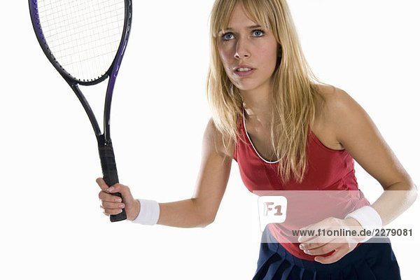 Studio-Porträt einer Tennisspielerin mit einem Tennisschläger
