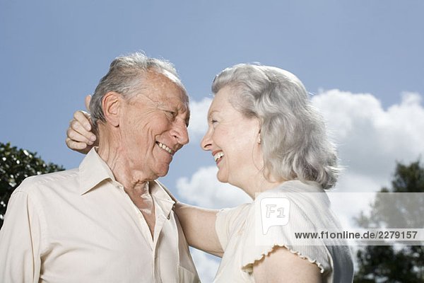A senior couple embracing