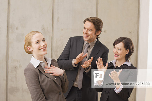 Business people in a meeting  applauding