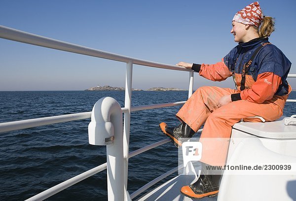 A woman sitting on a boat Sweden