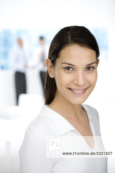 Young female office worker smiling at camera  portrait