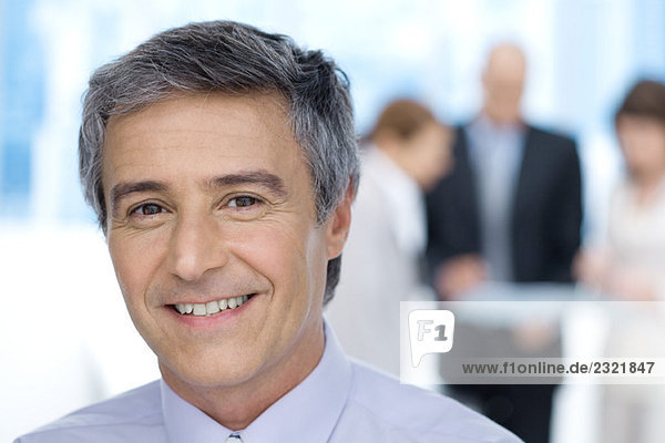 Businessman  smiling at camera  portrait