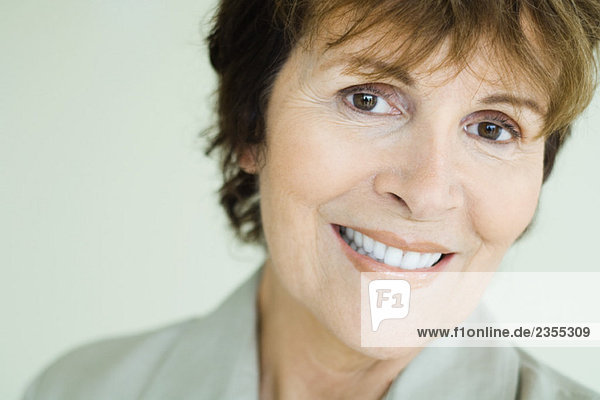 Senior woman smiling at camera  close-up  portrait