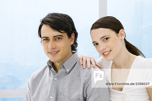 Couple smiling at camera  portrait