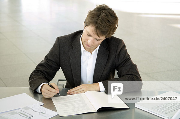 Close-up of a businessman working at a desk