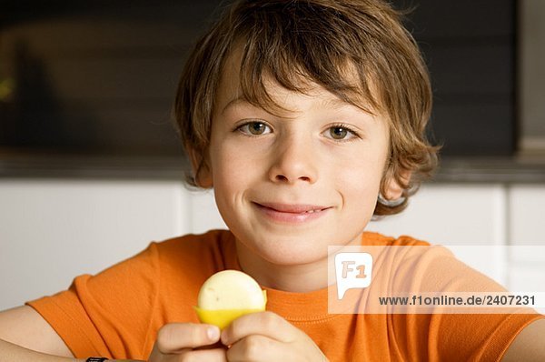 Portrait of a boy holding cheese