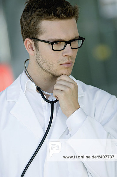 Close-up of a male doctor thinking