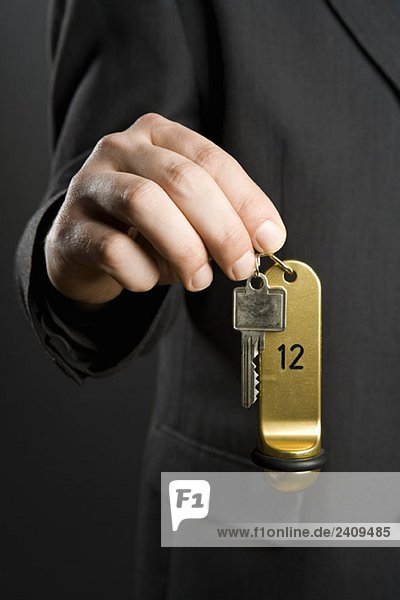 A man holding hotel key