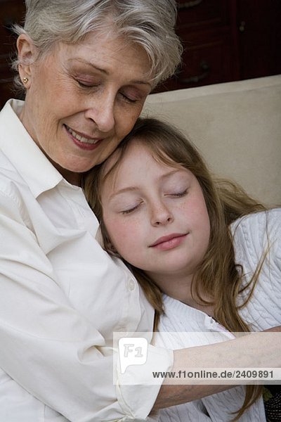 A grandmother and granddaughter napping