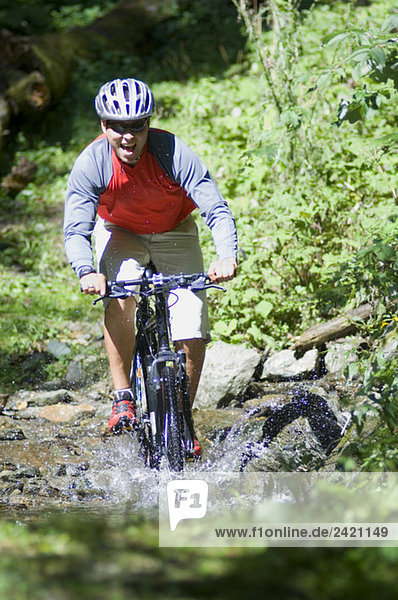 Mountainbiker crossing water