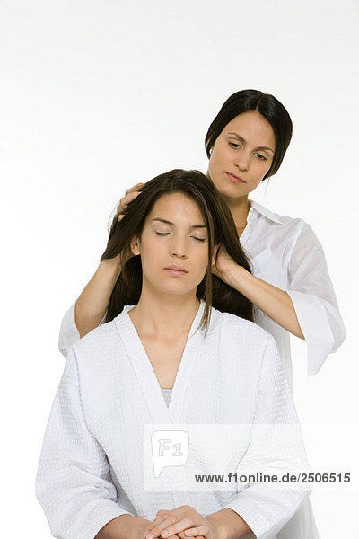 Woman receiving head massage  eyes closed